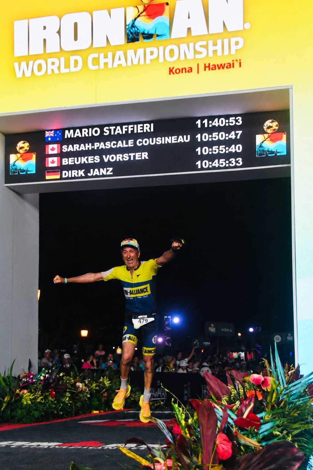 Mario Staffieri celebrating under the Ironman World Championship finish arch in Kona, 11:40:53